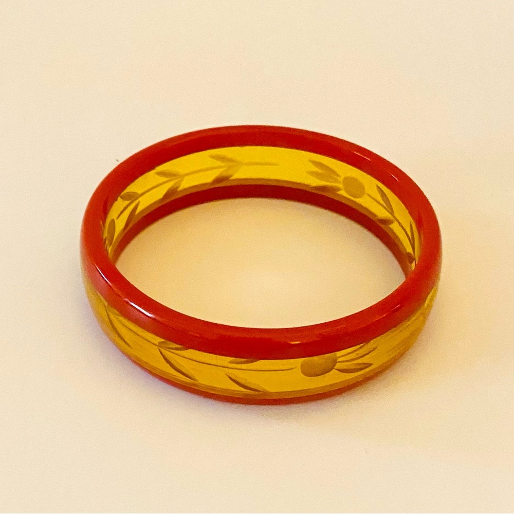 Vintage Bakelite Red And Applejuice Reversed Carved Floral Design Bracelet.